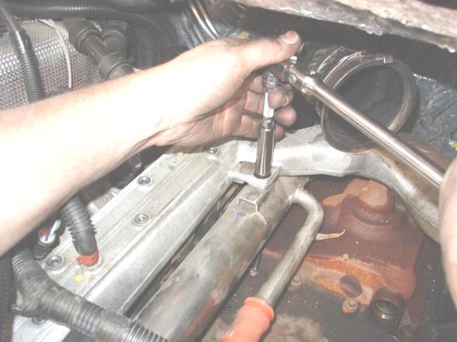 1 Step 12: Lightly push down on the EGR cooler while pulling up on the intake manifold to disengage from the manifold figure 9.