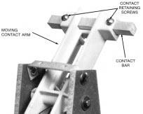 Hold the center insulating spacer in position and slide new contact bar into place. 5. Install retaining clip and spacer, secure with lockwasher and screw. 6. Slide outside insulators into position.