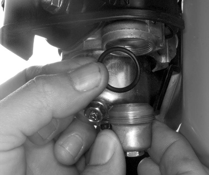 Remove fuel line grommet from fuel tank and pull out inlet fuel line from tank. NO. 6 FUEL STRAINER Turn off fuel valve.
