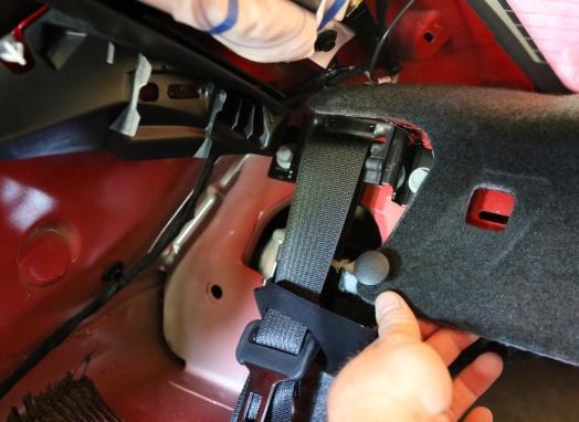 Remove the rear package shelf as shown below. Take off the seat belt assembly and the seat retaining brackets Removal of the seat belt assembly involves the removal of 3 bolts.