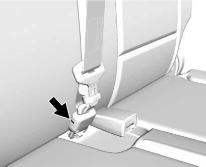 4. Disconnect the rear seat belt mini-latch, using a key in the slot on the mini-buckle, and let the belt retract into the headliner. 5. Stow the mini-latch in the holder in the headliner. 6.