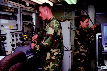 Kari Allen work with a wide array of test gear to check and recheck the systems that bring steel precisely down on target.