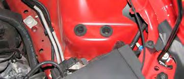 18. Remove the bolt that secures the stock airbox to the inner fender wall, then