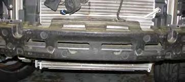 Use a 13mm socket to remove the passenger side, upper inside bumper bolt then replace it with the M8 x 30mm long