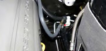 85. Install the supplied EVAP hose on the EVAP solenoid and route it back along the passenger side fuel