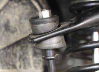 Remove the nut and upper sway bar link bushing on the top of the sway bar link on both sides. 28. Pull up on the sway bar so that the sway bar link is free. 29.