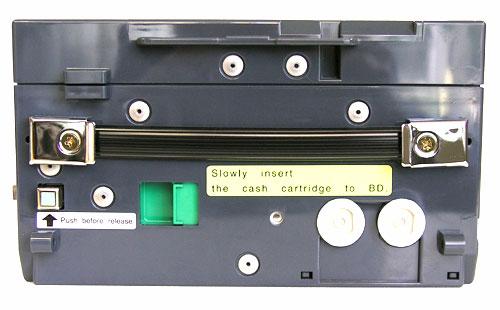 of the dispenser by the handle located on the front of the cassette.