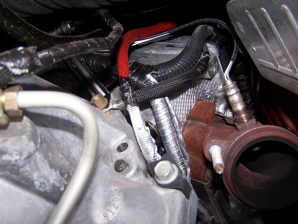 ) Loosen and remove the O2 sensor from both the left and right manifold. Make sure to mark each one appropriately so that they may be replaced in the correct side during reinstallation.