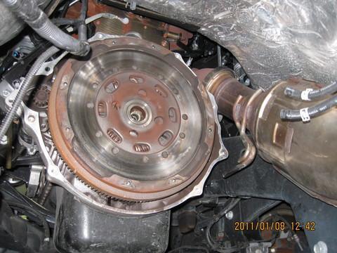 Lower it down to a safe level (the lower it is, the more stable it is) and wheel it back towards the back axle. 13. Now that the transmission is down you can finally see the OEM clutch.