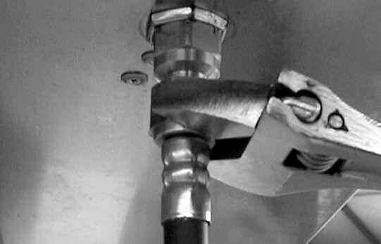 Remove the LP nipple brass fitting from main gas pipe. (See Fig.