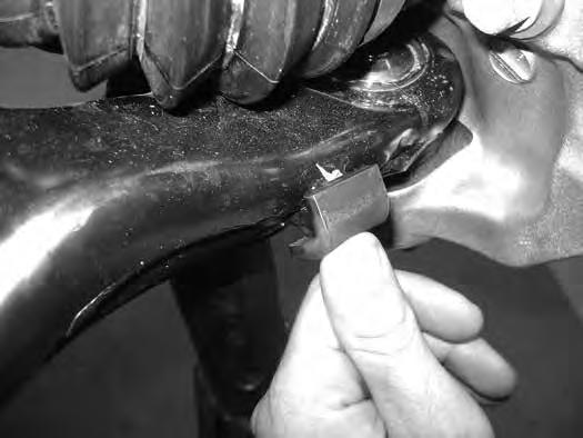 Raise lower control arm to reconnect the upper ball joint to the knuckle. Fasten with the OE nut. Torque the upper ball joint nut to 55 ftlbs. 21.