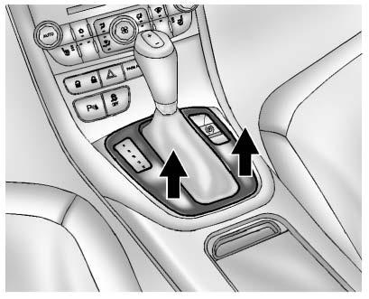 9-24 Driving and Operating To access the shift lock manual release: 1. Apply the parking brake.