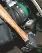 Remove the 2 brake line clamps on each front a-arm. Save this hardware for use on installation.