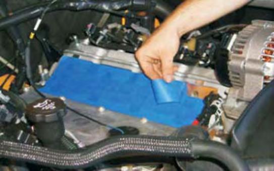 32. Using a vacuum cleaner, remove any dirt or debris from the intake port area.