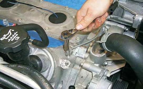 36. Using a 10mm socket wrench remove the two coolant vent
