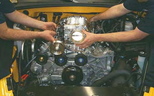 88. Remove tape from the cylinder head port faces and lubricate the surfaces with silicone spray