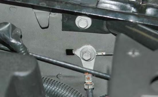 164. Remove ground connection on the inner fender well behind the battery with a