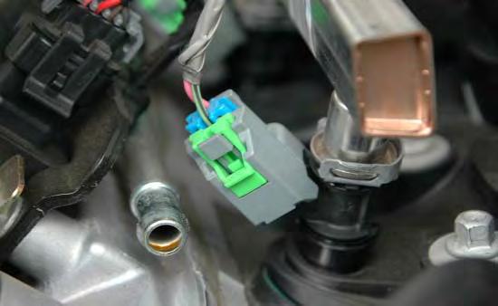 20. Disconnect the eight fuel injector connections by gently pulling up on the gray plastic release