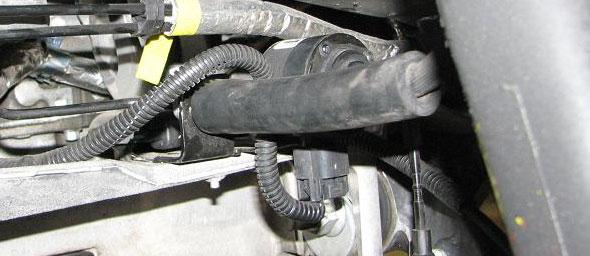 wrench to disconnect the two power steering lines from the