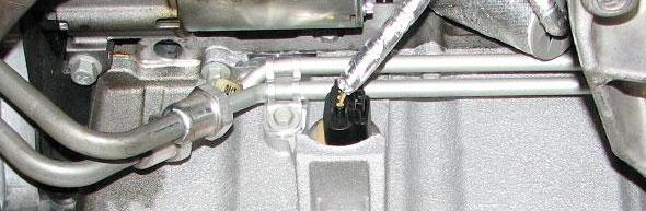 Loosen the rear engine cradle nuts with a 21mm deep socket and lower them until there is a gap of 10mm from the
