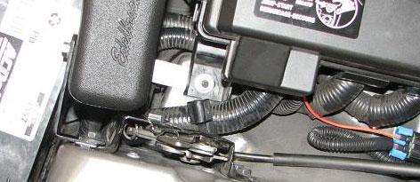 157. Use a 10mm socket to loosen rear hood hold down latch bolt on passenger side fender. 163.