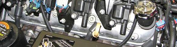 188. Tuck the fuel injector wiring harness and the EVAP Solenoid to Firewall Fitting Hose between the valve cover