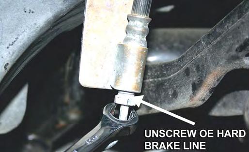 Before disconnecting the brake hoses, place a tray under the fittings to catch spilled