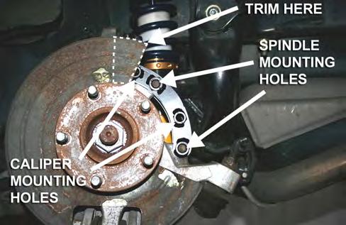 Use the first and third mounting hole (from the bottom) on the MM Caliper Relocation Bracket to attach it to the caliper mounting holes on the spindle. Re-use the stock caliper mounting bolts.