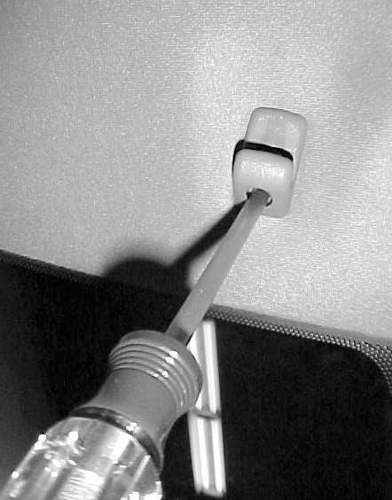 Remove screw from sun visor clips from driver and passenger sides and remove clips by pulling