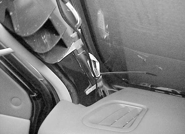 Attach the windshield wire cover to the mirror mounting bracket. iii. Slide the wire cover firmly under the headliner. Fig. E-1 iv.