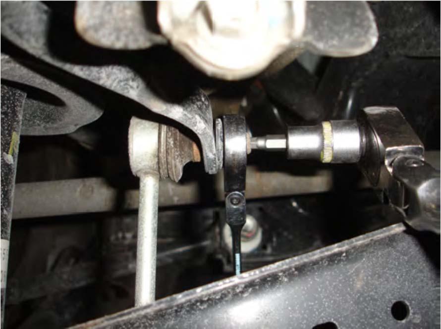 3. Use a 14mm open-end wrench to disconnect the sway bar endlink from the sway bar while using a 5mm allen wrench to