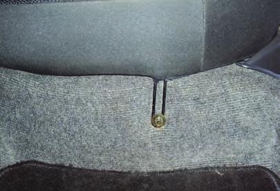 The seatback cushion is attached with 4 bolts at the base and tabs at the