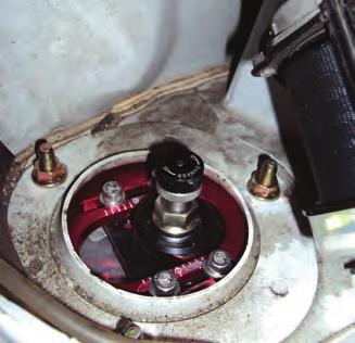 1. Unthread the three upper mount nuts within the cabin compartment and remove the strut from the vehicle (fig. 12). fig.