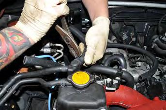 Do this fast so that coolant loss is kept to a minimum.