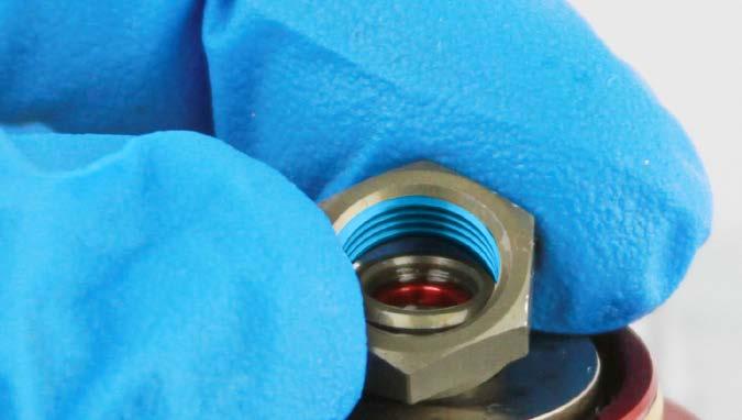 layer of Loctite Threadlocker Blue 242 only on the threads of the nut, then thread the