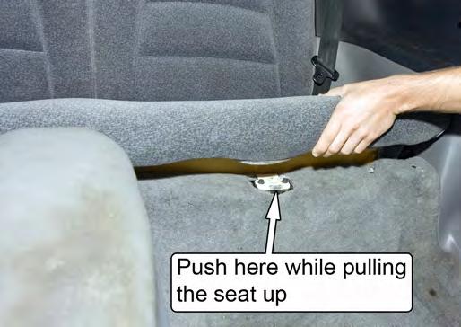 located underneath the front of the seat