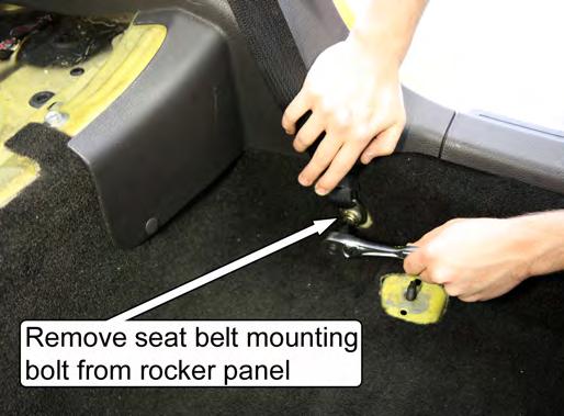 Push rearward on the two seat cushion release tabs while