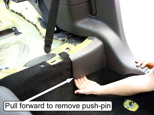 NOTE: Take care to avoid tearing the sound-deadening mat located