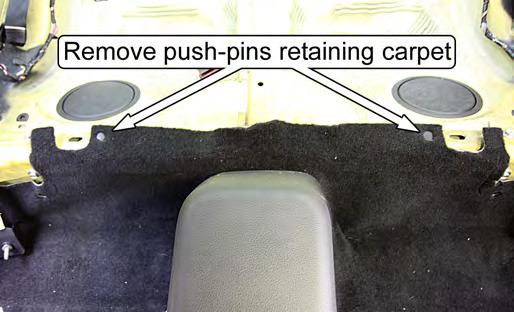 13. Remove the two push-pins retaining the carpet to the rear seat bulkhead. 15.
