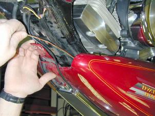Guide the new wire harness from the Signal Mirror to the electrical wiring. Cut off any excess slack in the wire.