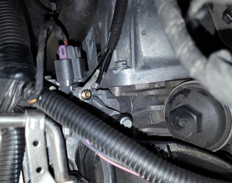- The factory ground strap is located on the back of the engine cylinder head, located above the oil filter housing.