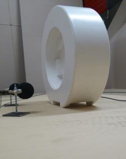 ISO/DIS 11819-2 recommends that reflecting surfaces are at least 200mm from microphones, which in turn are 200mm from the wheels. For an enclosed trailer, even with a 1.