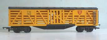 Excellent condition. 3S.63 Tri-ang R126 bogie Stock Car, slatted yellow sides with black roof. Sliding door each side. With TR shield and lettered TR742. Tension-lock couplings.