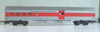 3S.29 00-Railway - Tri-ang T-C Cars - silver-red Tri-ang R130 T-C Series bogie Baggage Car, silver, with red window band. Grey roof. Two red sliding doors each side. Claw couplings. Good condition 3S.