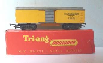 3S.49B Tri-ang R114 bogie Box Car. Yellow, with grey roof and grey sliding door each side. Lettered 'Tri-ang Railways TR 22831'. Tension-lock couplings. Almost mint.