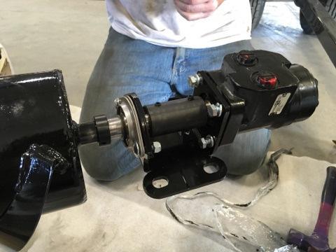 Attach the motor and bearing plate to the hydraulic motor using 4; 3/8-16 x 1 bolts, and 4; 3/8 lock washers.