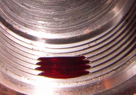 16. Place a ¾ diameter circle of Loctite 277 onto the lower area of the cylinder block