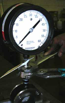 2. Turn the gauge assembly to a new direction as desired, and re-tighten the lock ring.