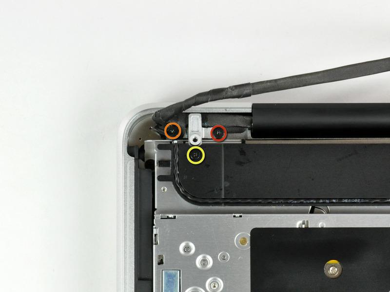 Paso 8 Remove the following screws securing the camera data cable and right speaker to the upper case: One 9.
