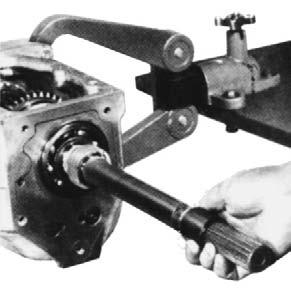 After removing the reverse speed gear and synchronizer assembly, a puller is required to remove the 5 6 driven gear (Figure 8-33).